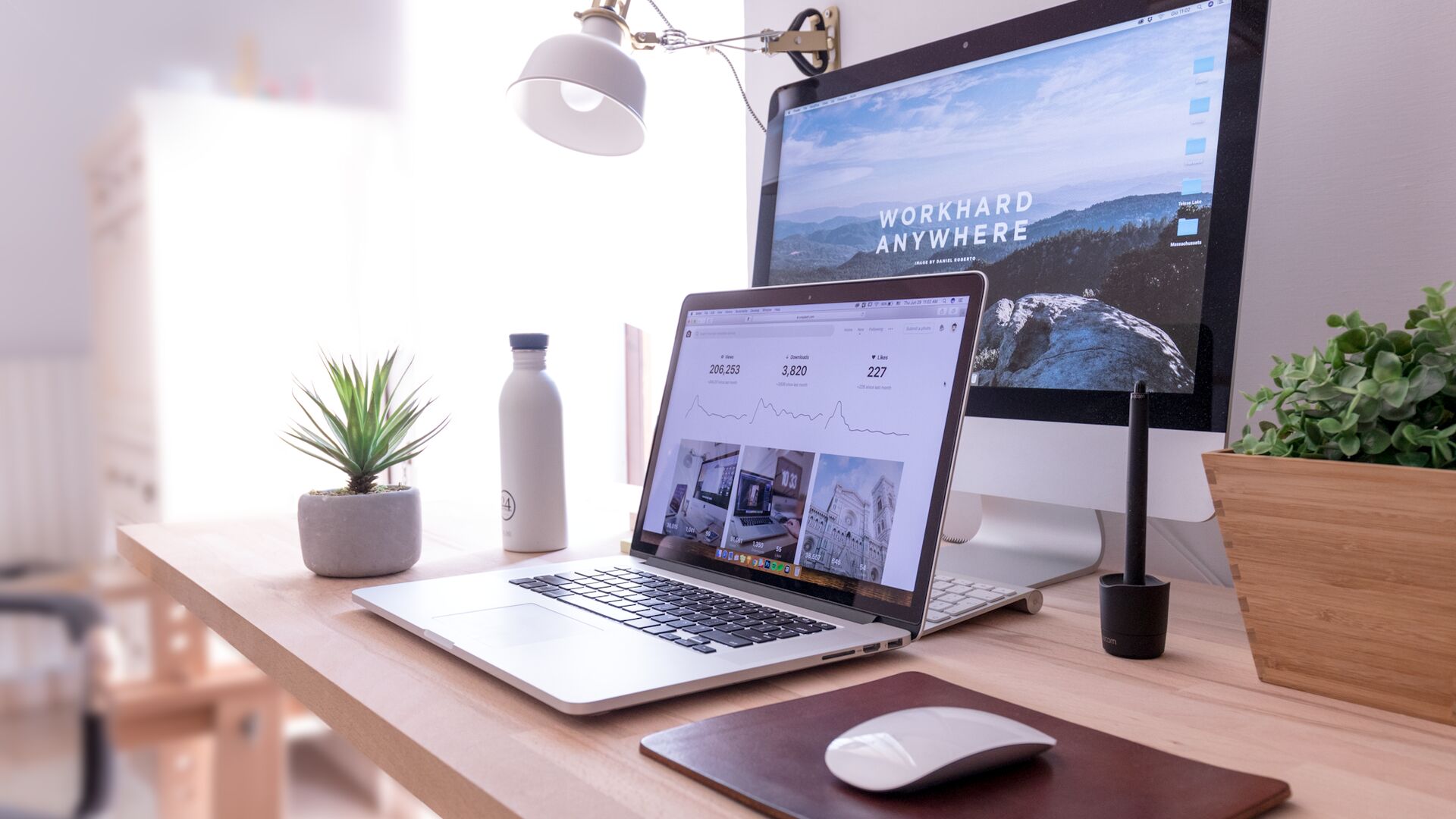 A desktop monitor and laptop showing the same responsive interface